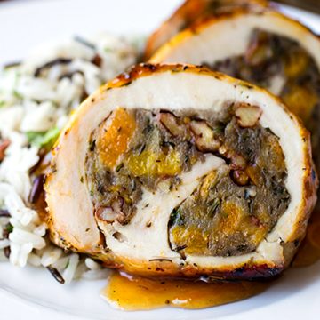 Chicken Roulade with Apricot Whiskey Glaze on a plate with rice | thecozyapron.com