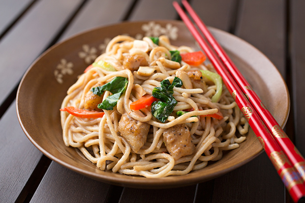 Saucy Peanut Chicken With Veggies Over Brown Rice Noodles, Deliciously Tangled Up