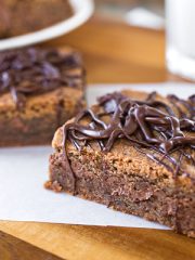 Chocolate Peanut Butter Cookie Bars with a glass of milk | thecozyapron.com