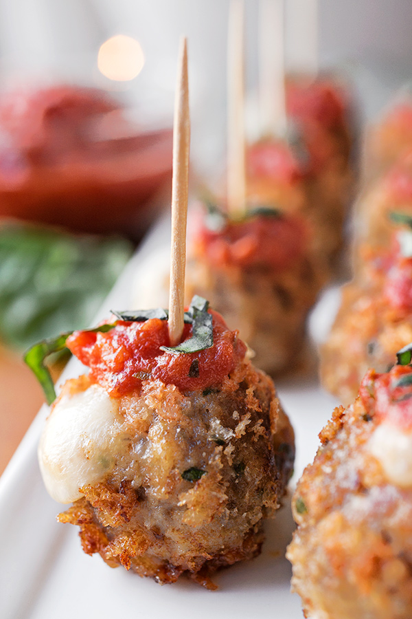 Crispy Caprese Meatballs Stuffed with Fresh Mozzarella, topped with ...