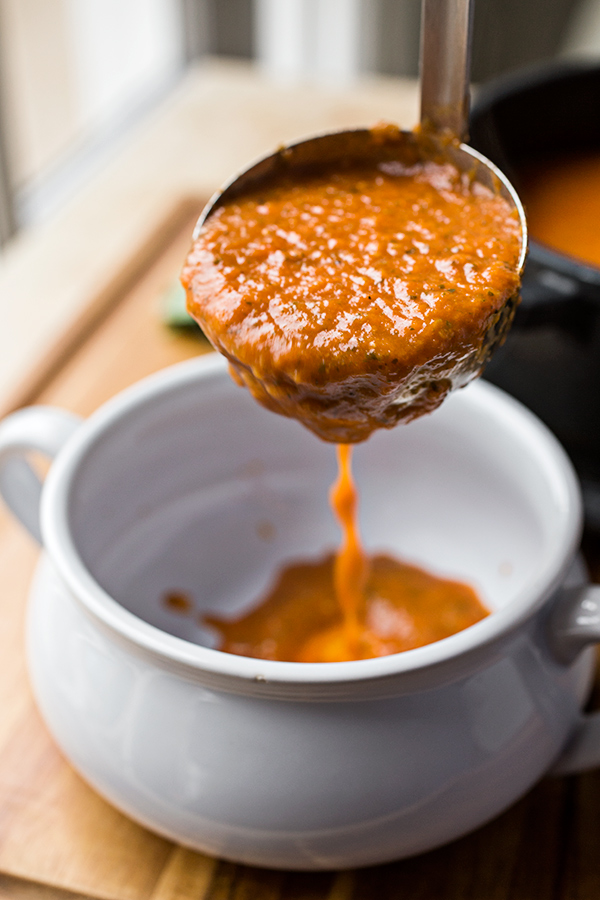 A ladle full of Grilled Cheese Tomato Soup | thecozyapron.com