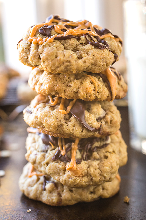 Stack of Oatmeal Scotchies with Chocolate Chips and a glass of milk | thecozyapron.com
