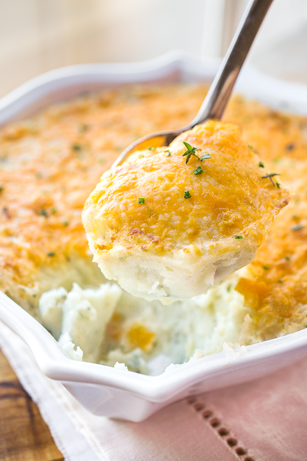 Cheesy Mashed Potatoes on Serving Spoon | thecozyapron.com