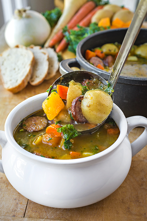 Harvest Stew with Smoked Sausage in a Ladle | thecozyapron.com