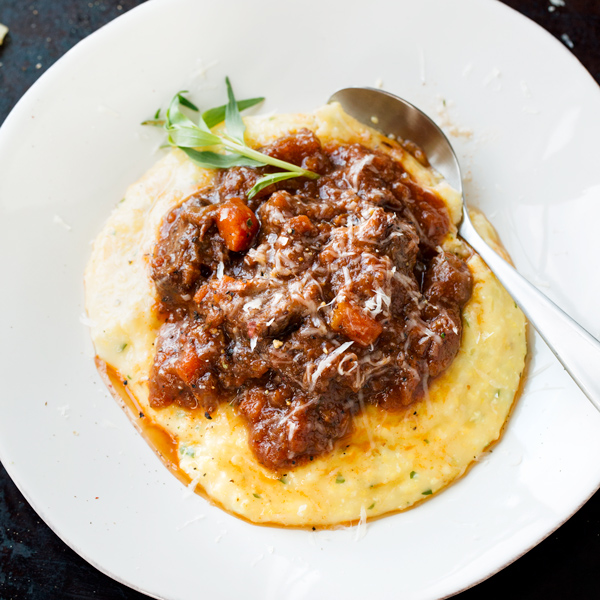 Braised Oxtail over Herb Polenta | thecozyapron.com