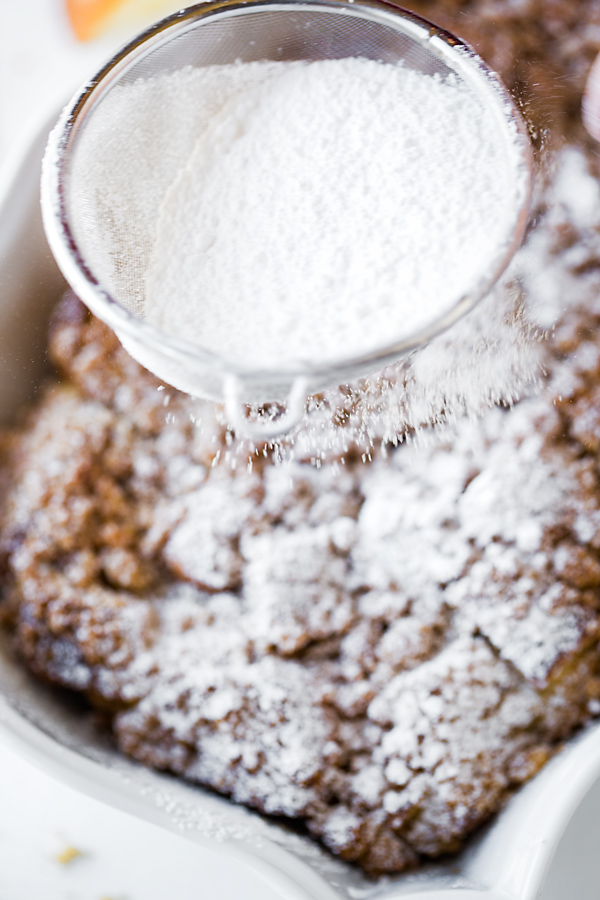Brioche French Toast Casserole Sprinkled with Powdered Sugar | thecozyapron.com