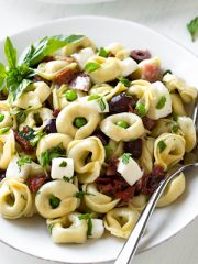 A bowl of Tortellini Pasta Salad ingredients | thecozyapron.com