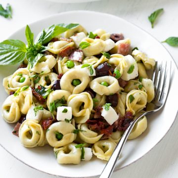 A bowl of Tortellini Pasta Salad ingredients | thecozyapron.com