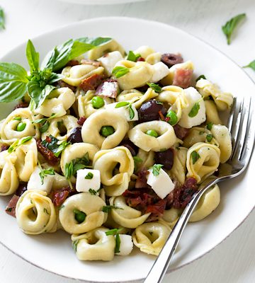 A bowl of Tortellini Pasta Salad ingredients | thecozyapron.com