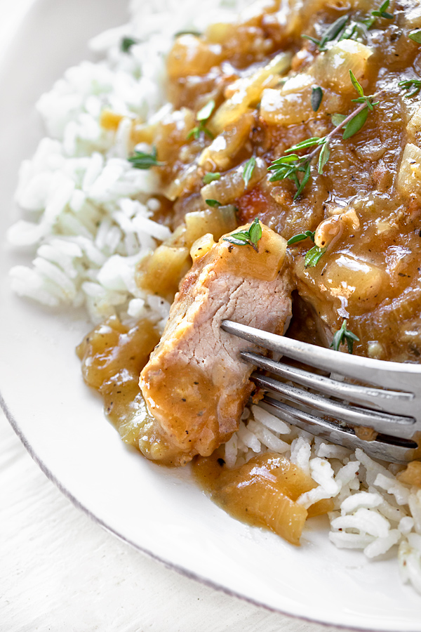 Smothered Pork Chops in a Savory Pan Sauce | thecozyapron.com