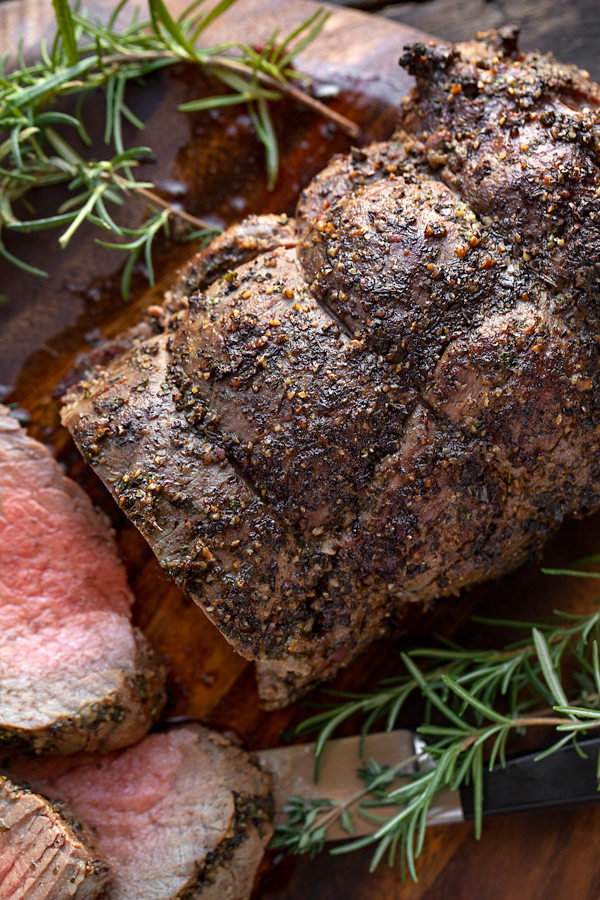 Beef Tenderloin with Herb-Pepper Crust on Cutting Board | thecozyapron.com