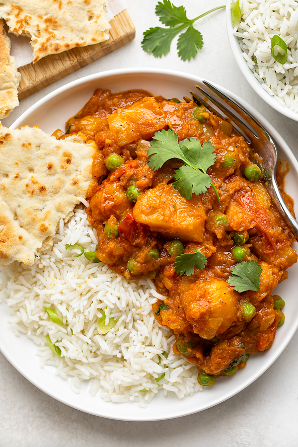 Bowl of Potato Curry with Peas | thecozyapron.com