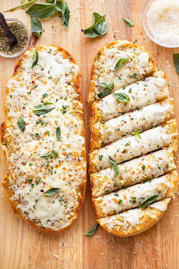 Cheesy Garlic Bread on Cutting Board | thecozyapron.com