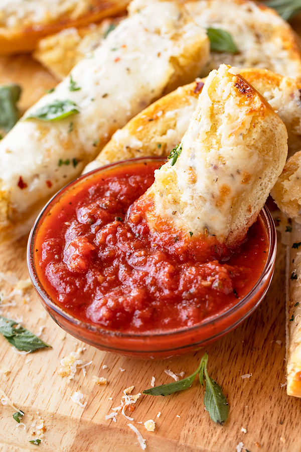 Cheesy Garlic Bread Dipped in Marinara | thecozyapron.com