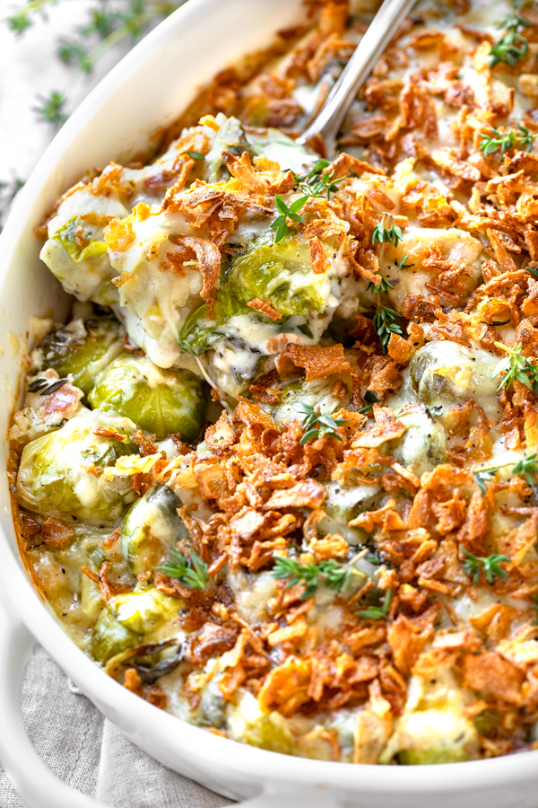 Cheesy Brussels Sprouts Casserole with a Spoon | thecozyapron.com