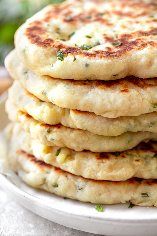 Stack of Freshly Prepared Flatbread with Garlic and Herbs | thecozyapron.com