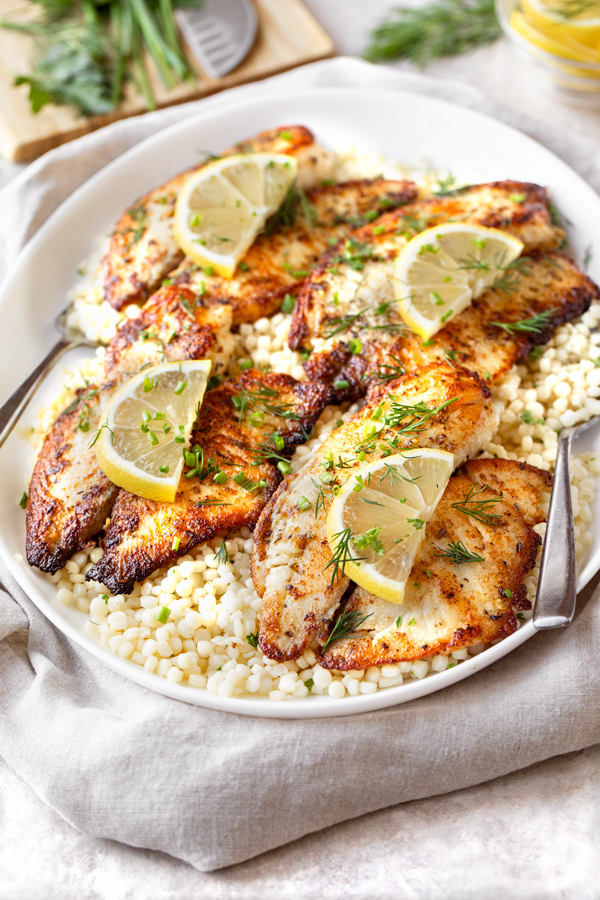 Tilapia with Lemon and Herbs over Couscous | thecozyapron.com