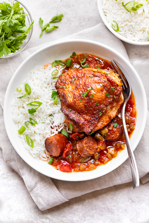 Braised Chicken with Andouille Sausage over Rice | thecozyapron.com