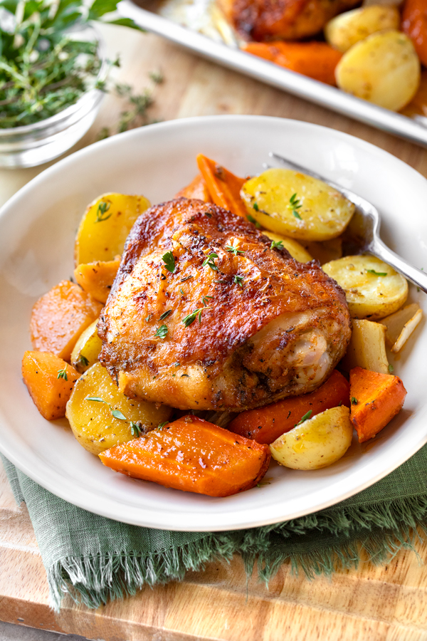 Sheet Pan Chicken Thighs with Vegetables on a Plate | thecozyapron.com