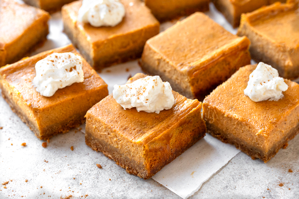 Pumpkin Pie Bars with whipped cream on top | thecozyapron.com
