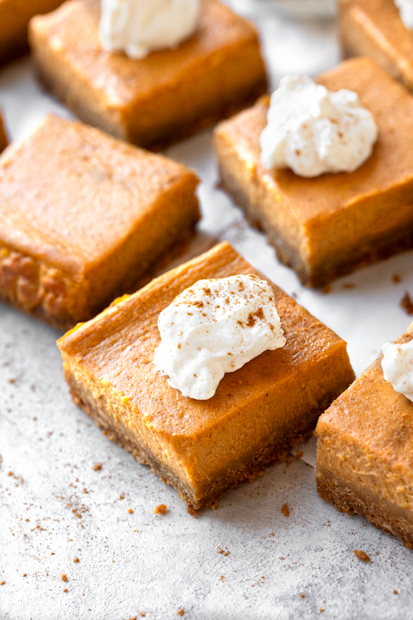 Pumpkin Pie Bars with whipped cream | thecozyapron.com