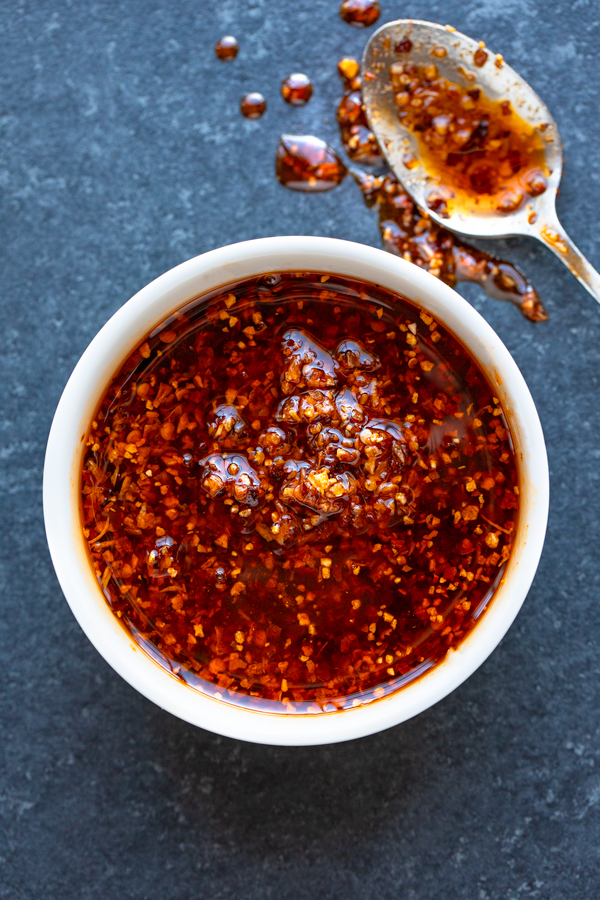 Closeup on a ramekin of Chili Crisp | thecozyapron.com
