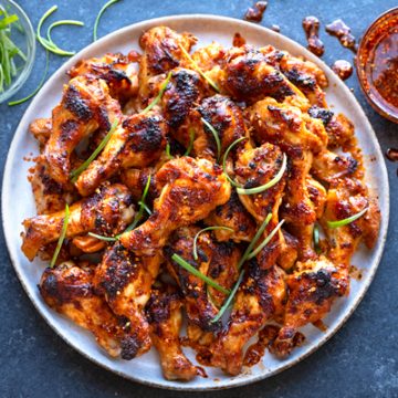 A plateful of Spicy Chicken Wings with Chili Crisp | thecozyapron.com