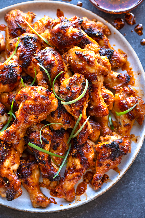 A plateful of Spicy Chicken Wings with Chili Crisp | thecozyapron.com