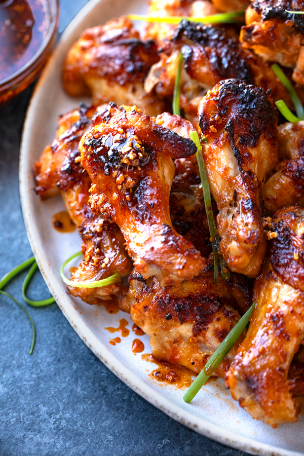 Closeup on a plateful of Spicy Chicken Wings | thecozyapron.com