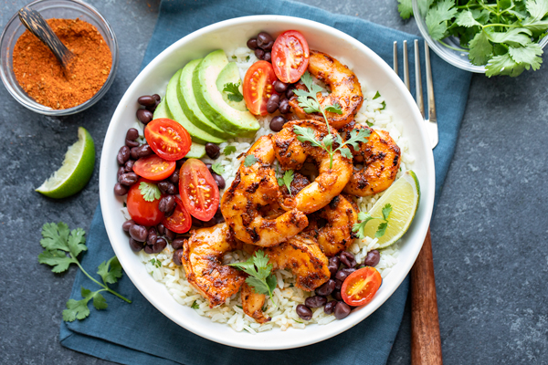 Blackened Shrimp Bowl topped with fresh cilantro | thecozyapron.com