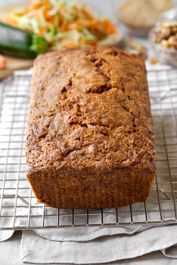 Fresh baked Zucchini Carrot Bread on a cooling rack | thecozyapron.com