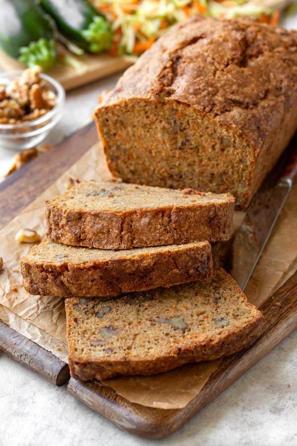 Freshly sliced Zucchini Carrot Bread on a cutting board | thecozyapron.com