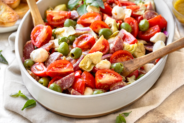 Fresh Antipasto Salad served in a serving bowl | thecozyapron.com