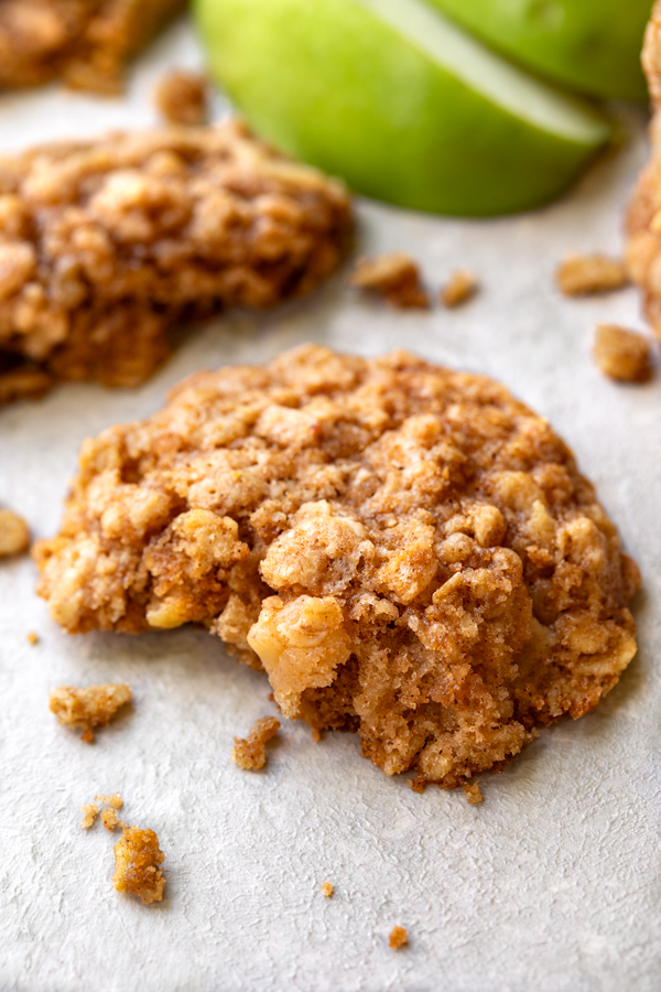 A freshly baked Apple Oatmeal Cookie with a bite out of it | thecozyapron.com