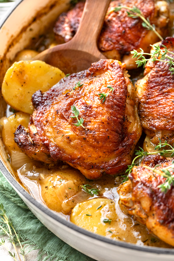 Closeup on Chicken and Potatoes in a roasting pan | thecozyapron.com