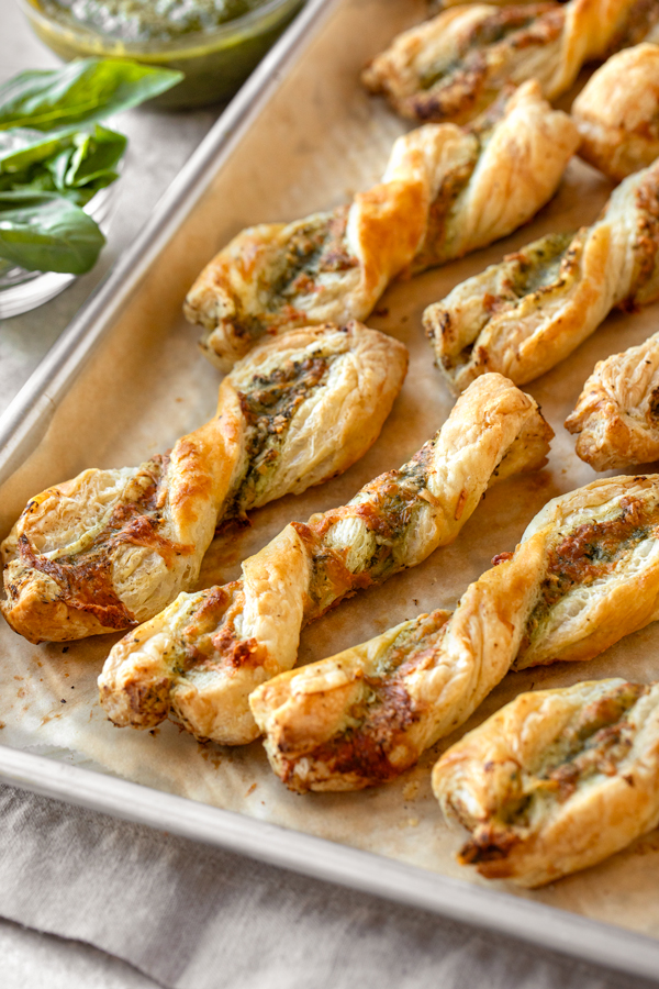 Fresh out of the oven Cheese Twists on a Baking Sheet| thecozyapron.com