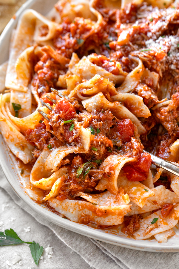 Closeup on a bowl of Pork Ragu over Tagliatelle Pasta | thecozyapron.com