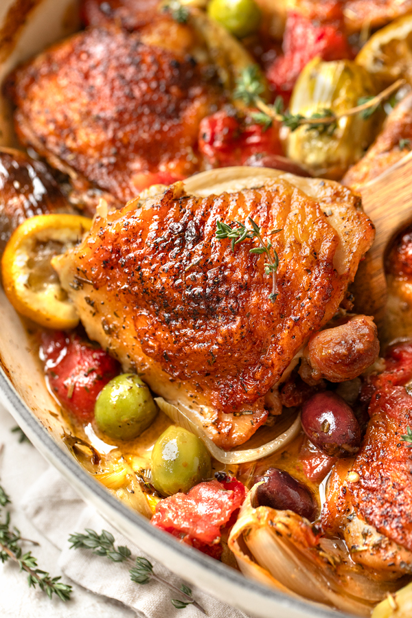 Closeup on a piece of chicken nestled in a Chicken Provencal recipe | thecozyapron.com