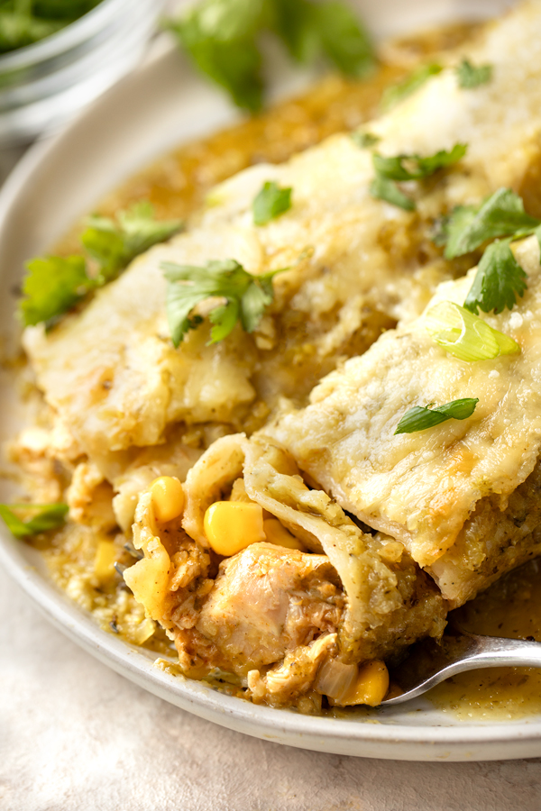 Closeup on a forkful of Salsa Verde Chicken Enchiladas | thecozyapron.com