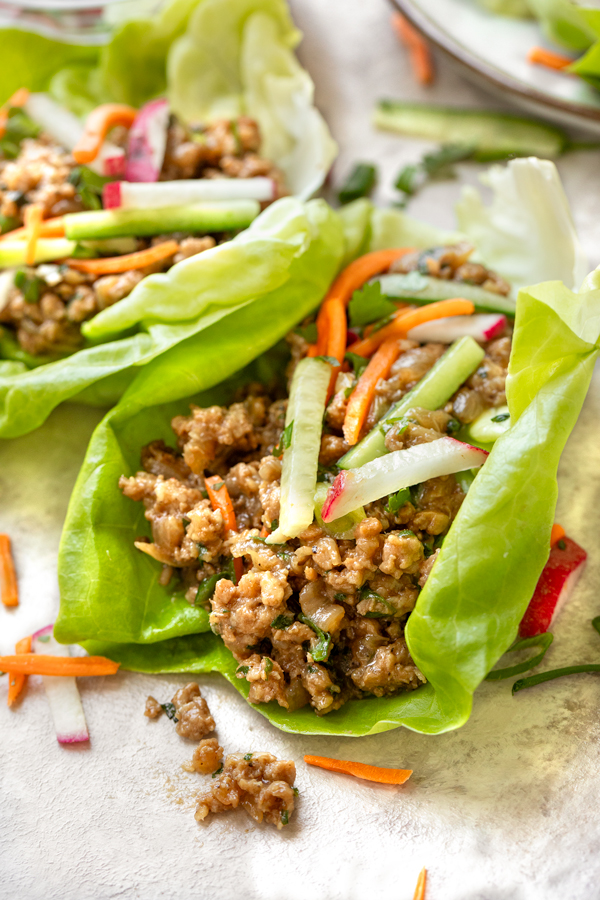 Closeup on a couple freshly made Pork Lettuce Wraps | thecozyapron.com