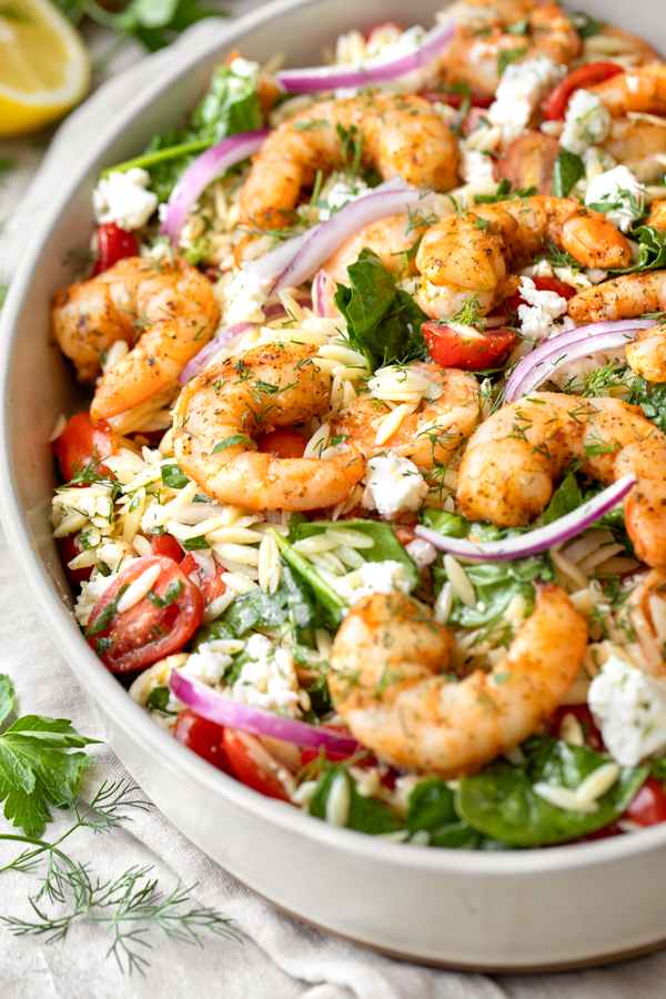 Closeup on a large serving dish of Shrimp and Orzo Salad | thecozyapron.com