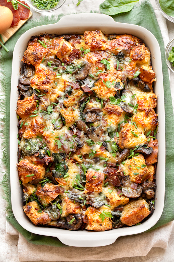 Overhead shot of Breakfast Strata in a baking dish, fresh out of the oven | thecozyapron.com
