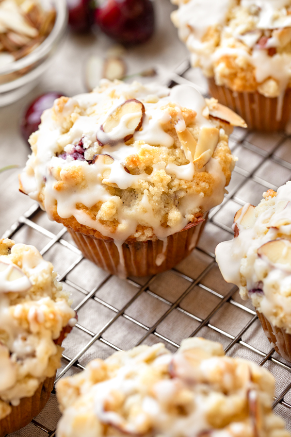 Closeup on a fresh baked Cherry Muffin cooling on a wire rack | thecozyapron.com