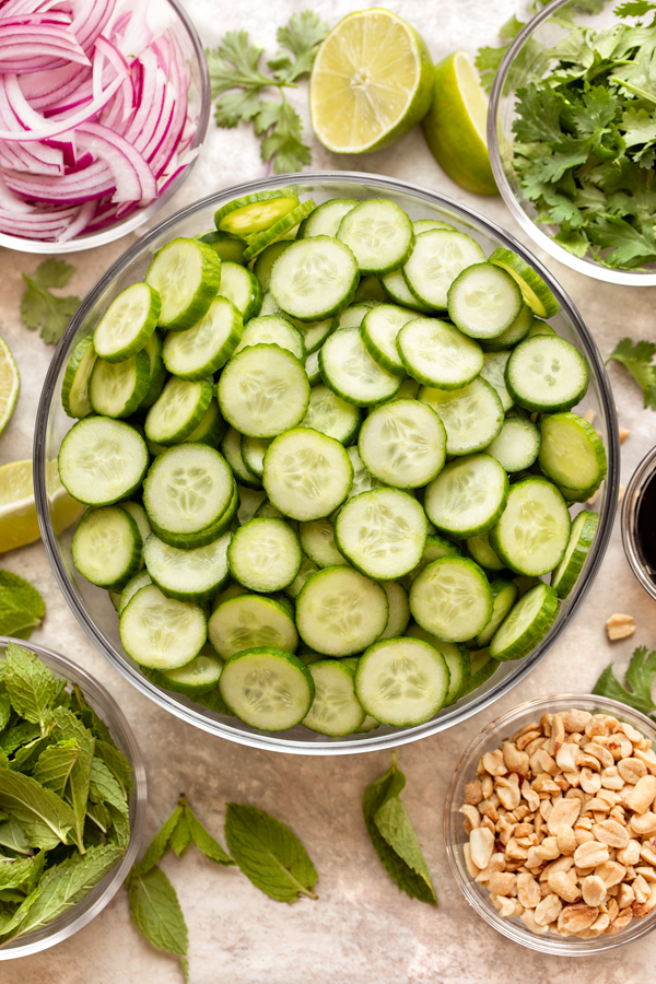 Fresh ingredients for Thai Cucumber Salad gathered in bowls and ramekins | thecozyapron.com