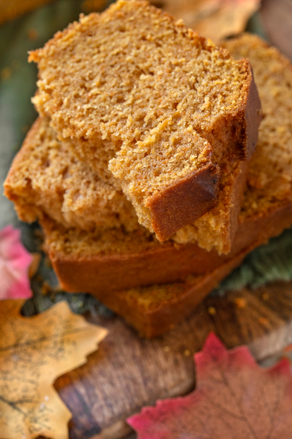 Closeup on a stack of a few slices of warm Maple Sweet Potato Bread | thecozyapron.com