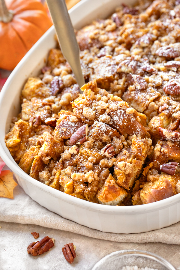 A bit serving spoon full of Pumpkin French Toast Casserole | thecozyapron.com